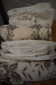A mixed box of vintage and antique table linen to include cut work examples, tray cloths with