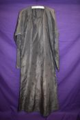 An early 20th century hand sewn Chinese silk traditional costume.