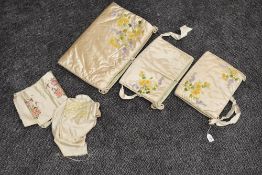 Three beautiful quilted silk nightdress and undergarment cases having delicate floral ribbon work to