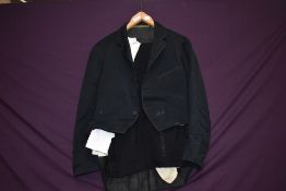 A pair of gents 1940s wool trousers having button fly, a 1960s evening shirt, some staining, also