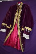 A red velvet flunky's jacket, made in Italy with handmade lace cuffs, worn at Covent Garden,
