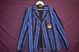 A 1930s striped school blazer having Barrow in Furness label reading E Todd and son.