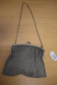 A silver mesh evening bag with clip clasp and carry chain, London 1919, Heasman & Co, bearing import