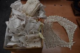 A box full of vintage and antique crotchet edging and similar.