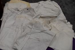 A good amount of antique children's and babies clothing to include quilted bib, christenings dresses