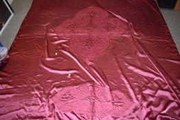 A 1930s pink satin bed throw having Soutache braid detailing, around a double in size.