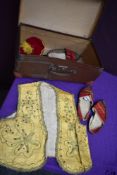 A suitcase containing a selection of vintage traditional Turkish dress.