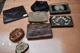 A mixed lot of vintage and antique handbags, assorted styles and eras.