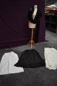 Two cotton petticoats and a black Victorian example, also included is a black lace shawl.