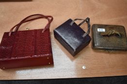 Two early 20th century box bags and a 1960s red clasp top snake skin effect bag.