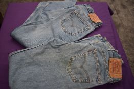 Two pairs of vintage Levi 501 jeans.
