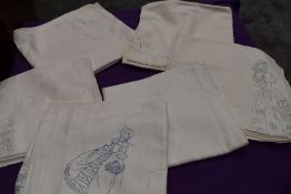 A collection of damask table cloths, each with printed scenes or crinoline ladies on , ready to