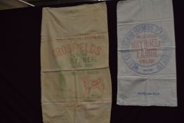 A vintage flour sack and a similar calf meal sack.