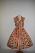 A vintage 1950s Berkertex overseas Continentals cotton day dress having bold novelty fruit print