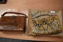 Two circa 1950s reptile skin handbags, one with box, both having clasp top fastenings.