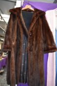 A vintage chestnut brown mink coat and a similar wide collar.