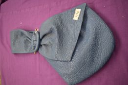 A wonderful 1950s Kendal Milne blue frame top clutch bag, having statement bow handle, matching