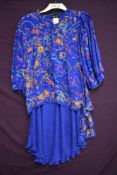 A 1980s collectable Diana Fres skirt and blouse set having bright pattern on purple ground.
