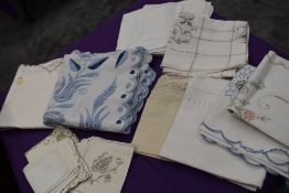 A selection of vintage and antique embroidered table linen, To include table cloths and napkins.
