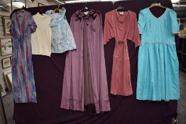 A selection of ladies mixed vintage clothing to include dresses, tops and velvet cape etc, various