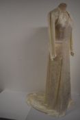 A 1940s 'Double eleven/ dinner plate label' utillity labelled bias cut wedding dress having
