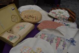 A lovely lot of six early 20th century tea cosies also a boxed tea cosy set, a Doyley case with