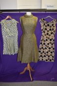 A Trio of vintage dresses to include 1950s silk spotted dress with cowl neck, 1960s metallic
