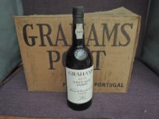 Eight bottles of Graham's 1975 Vintage Port, no strength of capacity on label, in card box