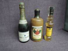 A stoneware bottle of Deutsches Erzeugnis Golden Delicious, no strength or capacity stated, a bottle