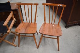 A pair of Ercol style spindle back dining chairs