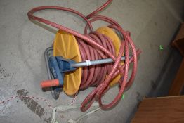 A large waterhose and reel