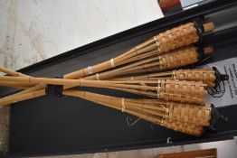 A set of Hawiian style garden torches