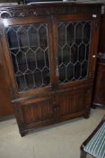 An Old Charm/Priory style bookcase with double cupboard under, width approx. 95cm
