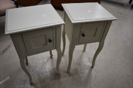 A pair of modern bedside pot cupboards