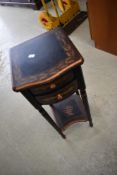 A reproduction painted bedside or similar table