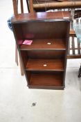 A reproduction mahogany dwarf bookshelf, width approx. 44cm