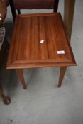 A mid century side table in Sapele
