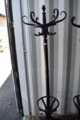 A traditional bentwood hat stand, ebonised finish
