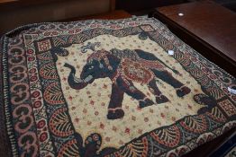 An Indian or similar throw , with elephant theme