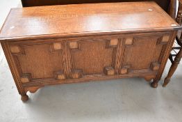 An early 20th Century oak bedding box , width approx. 121cm
