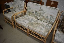 A three piece wicker conservatory suite