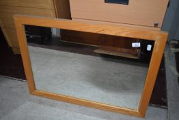 A modern beech effect wall mirror, approx 75 x 54cm