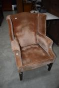 A Howard style wing back armchair