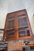 An early 20th Century slim bookcase