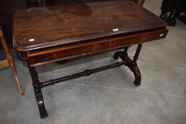 A 19th Century console or side table mahogany framed with turned base, drawer stamped Gillow