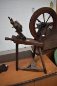 A traditional Haldane Hebridean spinning wheel having turned frame