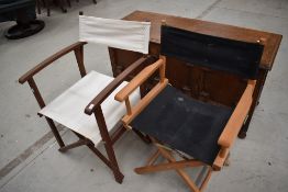 Two folding directors style chairs