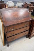 A reproduction mahogany bureau