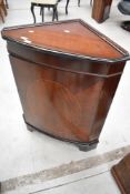 A Regency style reproduction mahogany corner unit.