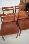 A set of four mid century teak backed chairs, having brown velvet upholstery, possibly G plan